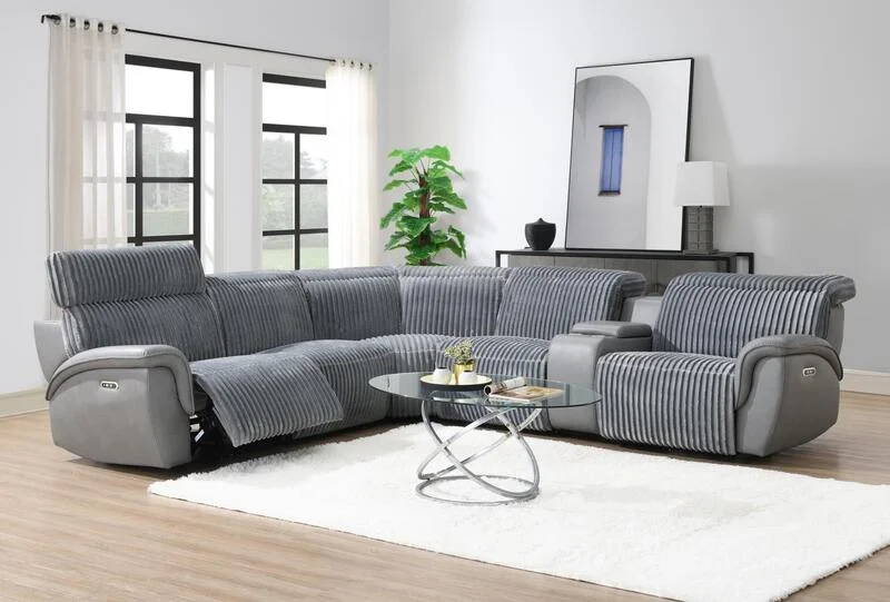 Gray sectional and accent chair in a bright living room